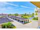 Elevated view showcasing covered parking, green space, and a partial glimpse of the waterfront at 10215 Regal Dr # 41, Largo, FL 33774