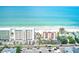 Beautiful aerial view of condos along the beach with blue ocean and white sand at 10215 Regal Dr # 41, Largo, FL 33774