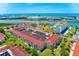 Stunning aerial view of the condos showing the waterfront location and lush landscaping at 10215 Regal Dr # 41, Largo, FL 33774