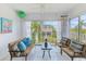 Inviting balcony showcasing stylish chairs and a glass table, perfect for enjoying the outdoor scenery at 10215 Regal Dr # 41, Largo, FL 33774