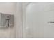 Modern bathroom featuring a stylish white-tiled shower and neutral-toned tiles at 10215 Regal Dr # 41, Largo, FL 33774