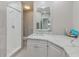 Clean and modern bathroom featuring a walk-in shower and a sleek vanity with marble countertop at 10215 Regal Dr # 41, Largo, FL 33774