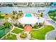 Aerial view of the clubhouse with a pool, tennis courts and boat docks at 10215 Regal Dr # 41, Largo, FL 33774
