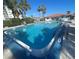 A view of the community pool and nearby lounge chairs at 10215 Regal Dr # 41, Largo, FL 33774