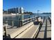 Dock with benches offering a scenic waterfront view at 10215 Regal Dr # 41, Largo, FL 33774