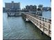 Beautiful wooden dock with railings on the water at 10215 Regal Dr # 41, Largo, FL 33774