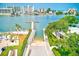 A waterfront property with lush landscaping, featuring a boat launch, pier, and community amenities at 10215 Regal Dr # 41, Largo, FL 33774