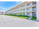 Well-maintained condo building featuring balconies, and nicely manicured grounds at 10215 Regal Dr # 41, Largo, FL 33774