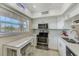 Bright, updated kitchen with stainless steel appliances, and quartz countertops at 10215 Regal Dr # 41, Largo, FL 33774