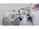 Relaxing living room boasting comfortable seating and sliding glass doors to the balcony at 10215 Regal Dr # 41, Largo, FL 33774