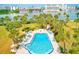 Tranquil community swimming pool with inviting lounge chairs surrounded by lush landscaping at 10215 Regal Dr # 41, Largo, FL 33774