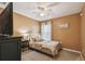 This comfortable bedroom offers great natural light and neutral tones at 105 Blue Alice Spring Ct, Ruskin, FL 33570