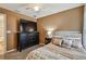 Cozy bedroom with a large dresser, a ceiling fan and decorative pillows at 105 Blue Alice Spring Ct, Ruskin, FL 33570