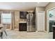 Open kitchen area featuring dark cabinets, stainless refrigerator, and view of dining area at 105 Blue Alice Spring Ct, Ruskin, FL 33570