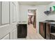 Pass through Laundry Room with countertop and stainless steel appliances at 105 Blue Alice Spring Ct, Ruskin, FL 33570