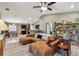 Spacious open concept living room featuring a lounge area and a view of the dining and kitchen areas at 105 Blue Alice Spring Ct, Ruskin, FL 33570