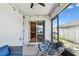 Screened-in patio with lounge seating and view to backyard through the sliding door at 105 Blue Alice Spring Ct, Ruskin, FL 33570
