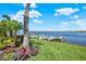 Picturesque dock with steps down to the serene lake, complemented by colorful landscaping at 11743 Lake Lucaya Dr, Riverview, FL 33579