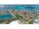 Aerial view of the community nestled along the waterways of Johns Pass with a sandbar in the background at 12140 Capri S Cir, Treasure Island, FL 33706