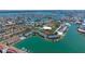 Aerial view of waterfront condos, boat docks, and lush landscaping of the bayside community at 12140 Capri S Cir, Treasure Island, FL 33706