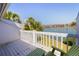 Balcony with view of blue water, palm trees and other condominiums at 12140 Capri S Cir, Treasure Island, FL 33706