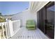 Balcony featuring a matching chair and small table with a sliding glass door at 12140 Capri S Cir, Treasure Island, FL 33706