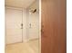 Bright entryway with mirrored wall and tile floor at 12140 Capri S Cir, Treasure Island, FL 33706