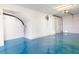 Garage has painted floors, updated lighting, and overhead door with opener at 12140 Capri S Cir, Treasure Island, FL 33706