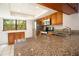 Spacious kitchen with granite countertops, stainless steel appliances, and ample cabinet space at 12140 Capri S Cir, Treasure Island, FL 33706
