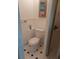Compact bathroom featuring white toilet and shower with glass door and tile floor at 126 Philadelphia Blvd # 10, Palm Harbor, FL 34684