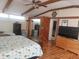 Spacious bedroom features wood flooring and nautical-themed décor at 126 Philadelphia Blvd # 10, Palm Harbor, FL 34684