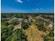 Wide angle aerial showing distant water views, blue skies, and spacious lot sizes at 130 Woodcutter Ln, Palm Harbor, FL 34683