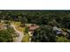 Wide angle aerial view of home showing mature trees in quiet neighborhood at 130 Woodcutter Ln, Palm Harbor, FL 34683