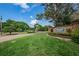 Welcoming entrance to Westlake Village, showcasing manicured landscaping and a sense of community pride at 130 Woodcutter Ln, Palm Harbor, FL 34683