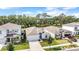 Aerial view of the single Gathering home showing the roof and manicured lawn at 13061 Brookside Moss Dr, Riverview, FL 33579