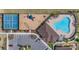 An aerial view of the community amenities showcases a pool, playground, tennis courts, and a parking area at 13061 Brookside Moss Dr, Riverview, FL 33579