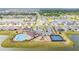 An aerial shot of a neighborhood featuring a pool, playground, tennis courts, and a lake at 13061 Brookside Moss Dr, Riverview, FL 33579