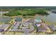 Ariel view of a neighborhood with a community center, including a pool, playground, parking and tennis courts at 13061 Brookside Moss Dr, Riverview, FL 33579