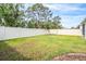 Spacious backyard surrounded by a privacy fence and mature landscaping, offering a serene outdoor space at 13061 Brookside Moss Dr, Riverview, FL 33579