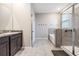 Bathroom showcasing a double sink vanity, tiled shower, a soaking tub and neutral color palette at 13061 Brookside Moss Dr, Riverview, FL 33579