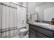 Bathroom showcasing a shower/tub combo with a decorative curtain, plus a granite countertop sink at 13061 Brookside Moss Dr, Riverview, FL 33579
