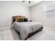 Bedroom with a queen-size bed, soft gray carpet, and natural light from a window with blinds at 13061 Brookside Moss Dr, Riverview, FL 33579