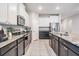 Contemporary kitchen featuring stainless steel appliances, granite countertops, and a large island at 13061 Brookside Moss Dr, Riverview, FL 33579
