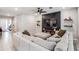 Spacious living room with a comfortable sofa, accent wall, and modern design elements at 13061 Brookside Moss Dr, Riverview, FL 33579
