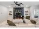 Cozy living room with modern decor, comfortable sectional sofa, and decorative shelving at 13061 Brookside Moss Dr, Riverview, FL 33579