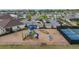 A neighborhood playground with slides, climbing structures, and benches at 13061 Brookside Moss Dr, Riverview, FL 33579