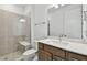Bathroom featuring a tiled shower with glass door, seat, and quartz countertop at 13631 Sunlight Meadow Dr, Riverview, FL 33578