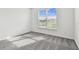 Empty bedroom featuring a large window and carpet flooring at 13631 Sunlight Meadow Dr, Riverview, FL 33578