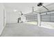 Spacious two car garage with high ceilings and automatic door openers at 13631 Sunlight Meadow Dr, Riverview, FL 33578