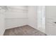 This walk-in closet includes wire shelving and carpet flooring at 13631 Sunlight Meadow Dr, Riverview, FL 33578